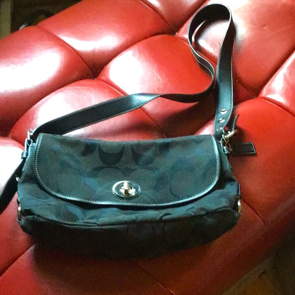 Coach black purse   Zipper on back.  New. No tags. Perfect condition